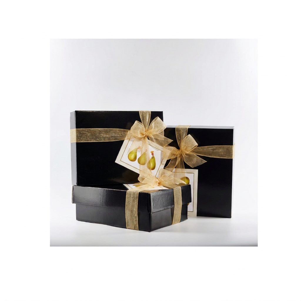 Black gift boxes with wide gold organza ribbons and centred bows